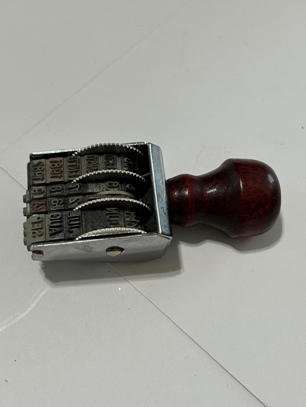 Source Unknown Metal Date Stamp with Dark Red Wood Handle